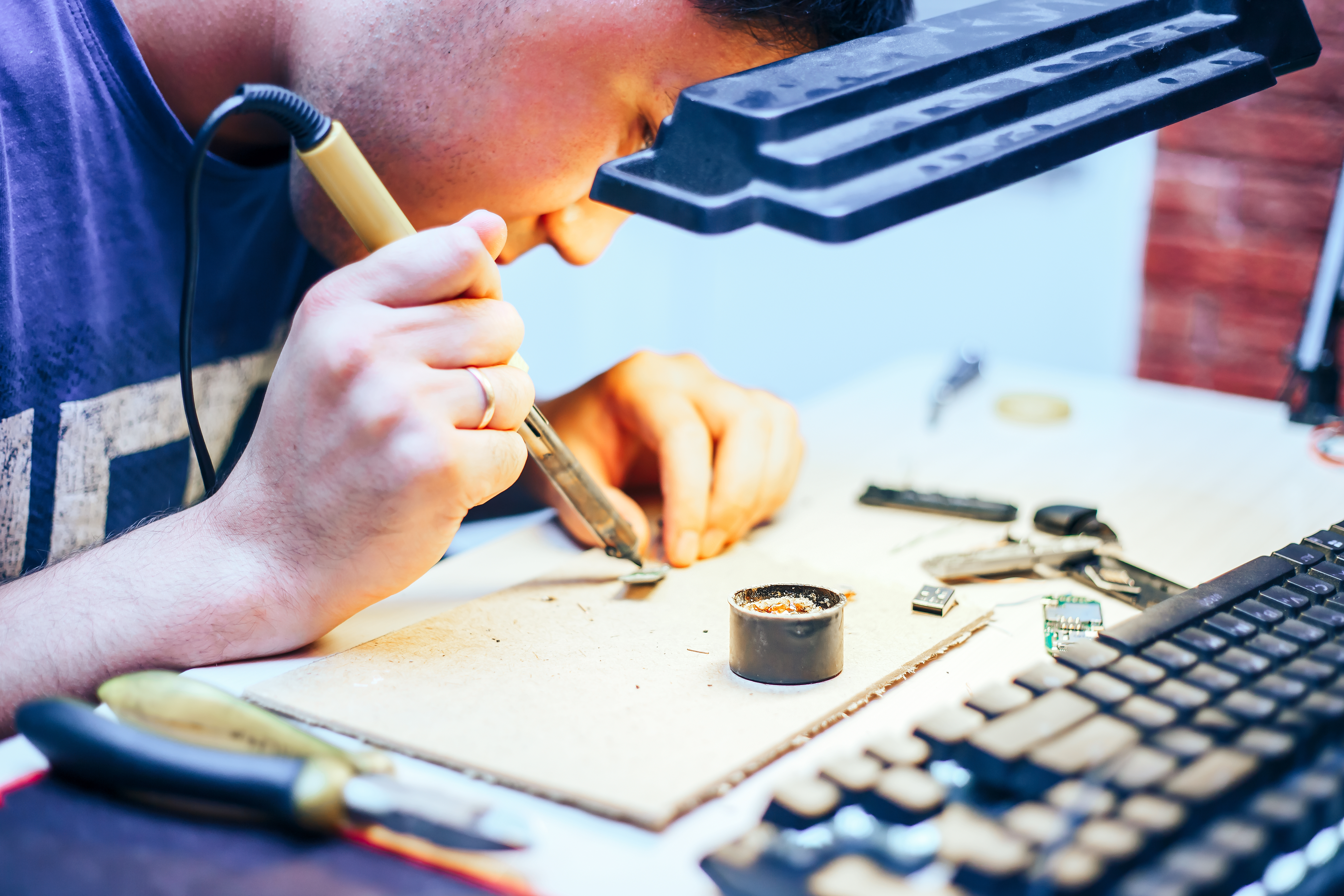 Image Of Engineer With Soldering Iron Repairing Me M8ZBGE8